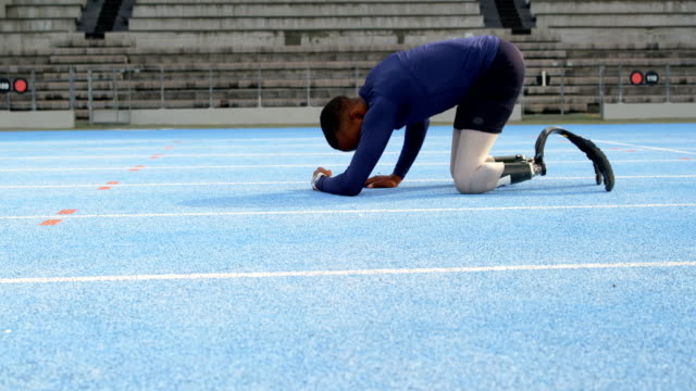 Disabled-athletic-relaxing-on-a-running-track-4k