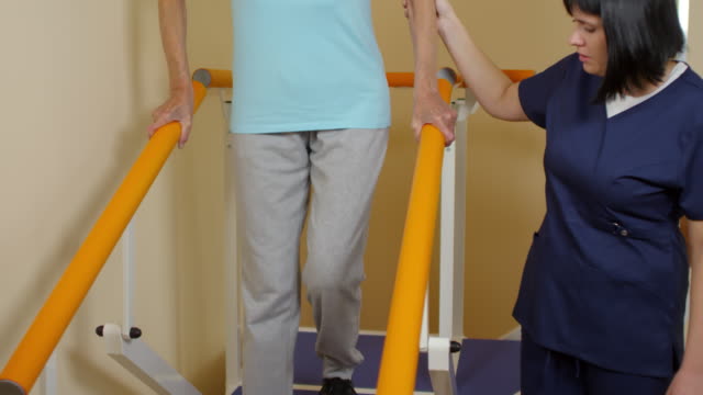 Physiotherapist-Helping-Elderly-Patient-Gait-Training-on-Stairs