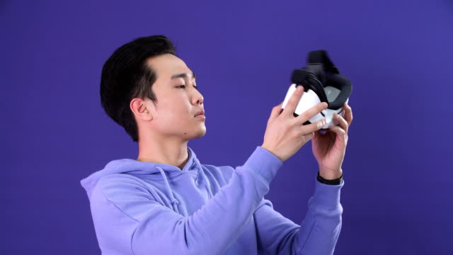 Korean-young-man-surprised-by-something-in-virtual-reality