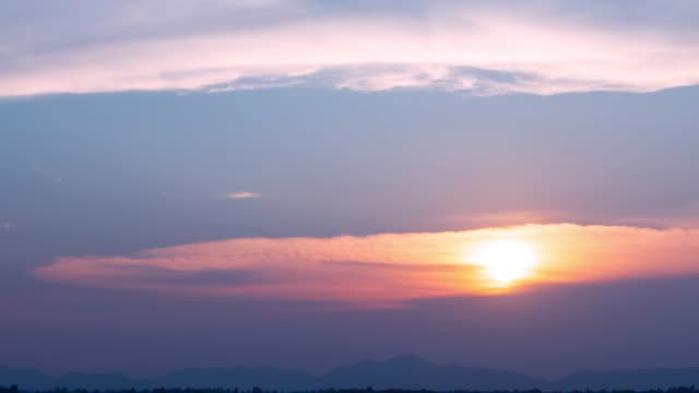 Time-lapse-nature-background.-Sunset-time-interval.-The-movement-of-clouds-and-Sun.