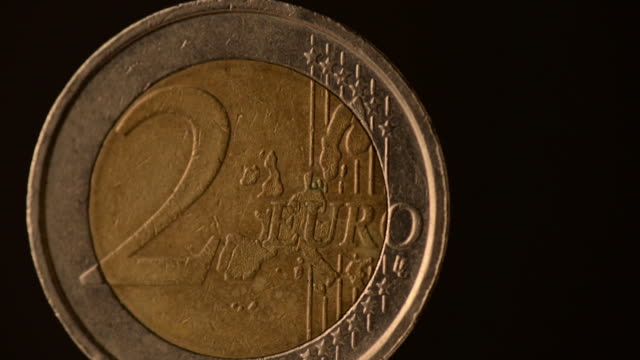 One--Euro-Coin-footage-on-a-black-background.