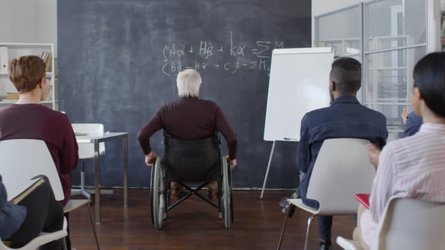 Disabled-Male-Professor-Entering-Classroom