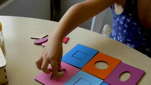 autistic-child-puzzles-close-up