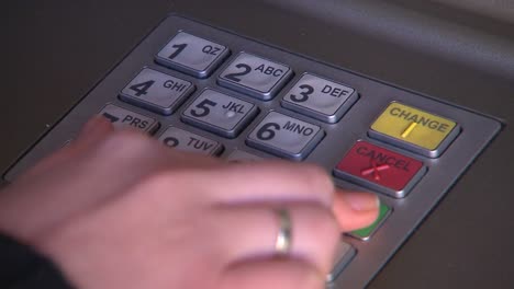 Withdrawing-money-at-bank-ATM