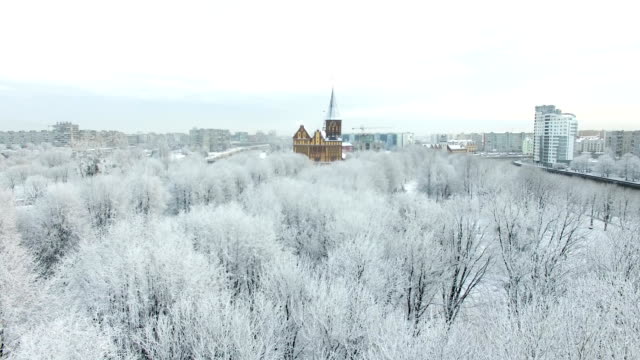Aerial:-The-Cathedral-in-the-snow-capped-city-of-Kaliningrad,-Russia