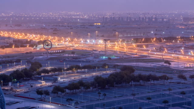 Aerial-view-of-Aspire-Zone-from-top-night-to-day-timelapse-in-Doha