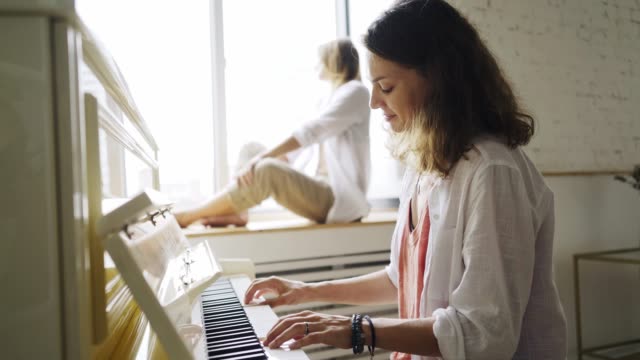 Girlfriends-playing-on-piano