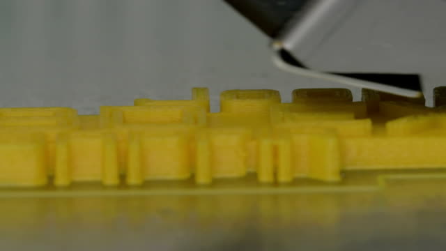 Close-up-view-of-printing-plastic-model-on-a-3D-printer-in-process