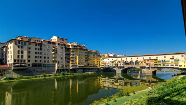 View-on-The-Ponte-Vecchio-on-a-sunny-day-timelapse-hyperlapse,-a-medieval-stone-segmental-arch-bridge-over-the-Arno-River,-in-Florence,-Italy