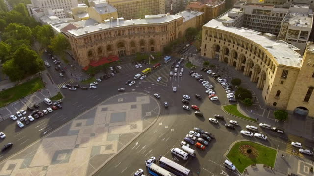 Transportation-in-Yerevan-town,-cars-driving-on-Republic-square,-traffic-rules