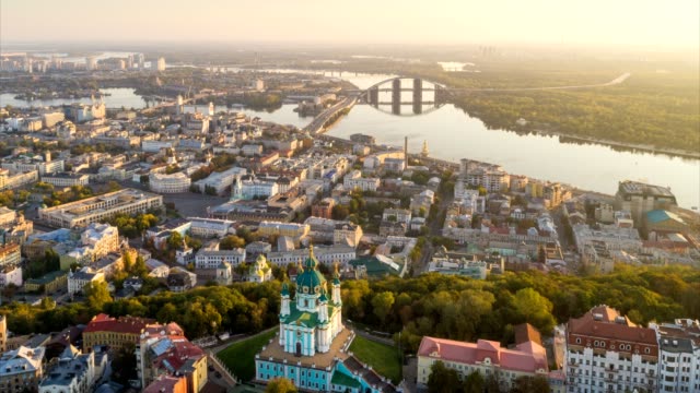 Kyiv--Kiev-,-Ukraine.-Aerial-hyperlapse-of-Kiev-old-city-center.-Flying-over-St.-Andrew's-Church-and-Podol-at-sunrise.-UHD-4K