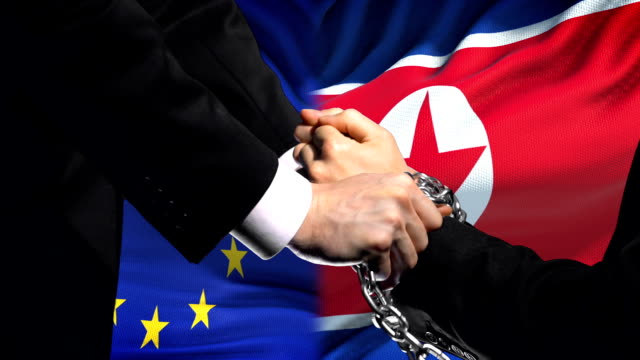 Europäischen-Union-Sanktionen-Nordkorea-angekettet-Arme-politischen-oder-wirtschaftlichen-Konflikt
