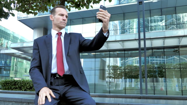 Businessman-Taking-Selfie-on-Phone