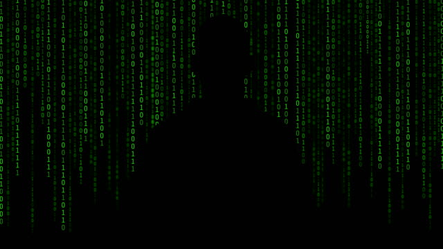 Hacker-de-pie-delante-de-los-números-01-o-binario-en-la-pantalla-del-ordenador-en-el-fondo-del-monitor,-código-de-datos-Digital-en-concepto-de-tecnología-de-seguridad-de-seguridad.-Anónimo