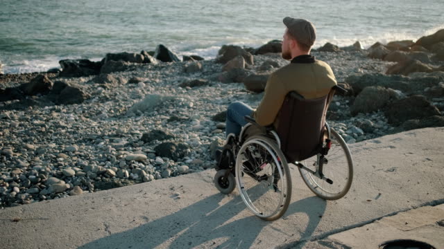 Lonely-disabled-man-staring-at-sea