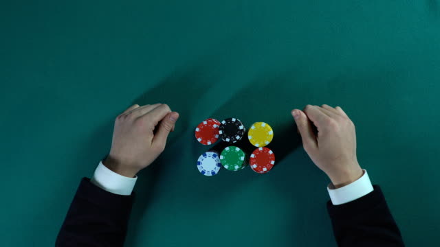 Businessman-betting-all-in-in-poker-game,-risky-decision,-cunning-and-bluff