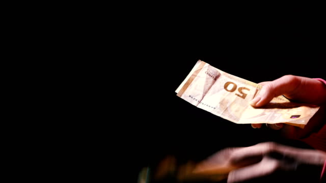 Money.-Hands-count-euros