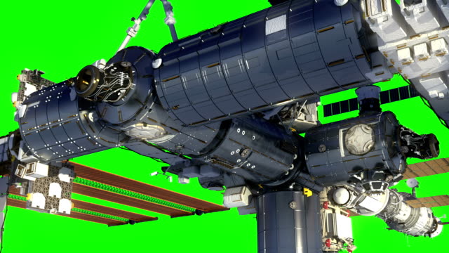 Flight-Of-International-Space-Station-In-Outer-Space.-Green-Screen.
