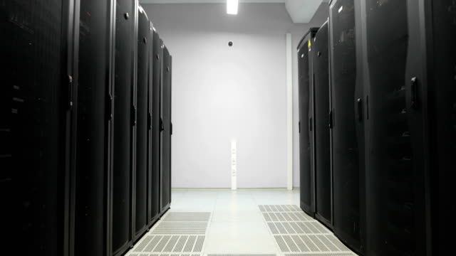 Servers-racks-walkthrough-in-Modern-data-center.-Cloud-computing-datacenter-server-room.-Cloud-computing-data-storage