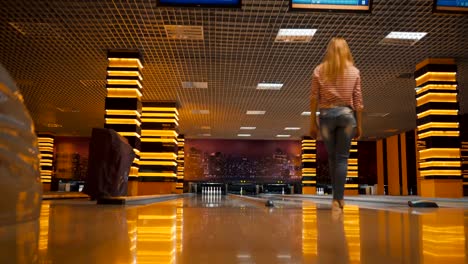 Friends-bowling-at-club-and-having-fun-playing-casually