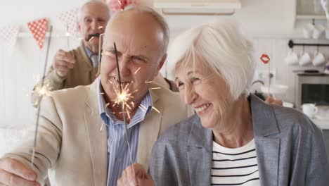 Company-of-Senior-Friends-Dancing-with-Sparklers