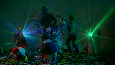 Children-and-adults-playing-with-colorful-ribbons-at-disco-party