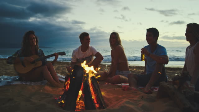 Friends-Relaxing-at-Bonfire-Beach-Party
