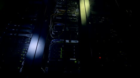 Network-servers-in-a-data-center.-Dark-server-room.
