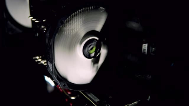 White-computer-fan-cooling-dark-computer