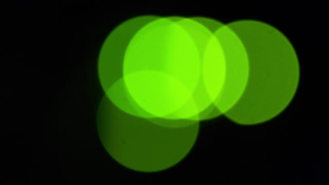 Green-bokeh-LED-lights-blinking-on-back-side-of-working-switch-in-server-room
