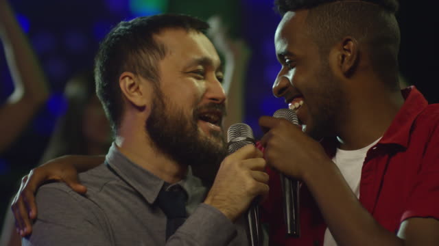 Diverse-Male-Friends-Hugging-and-Singing