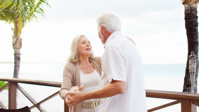 Retired-Caucasian-couple-evening-dancing-at-vacation-hotel