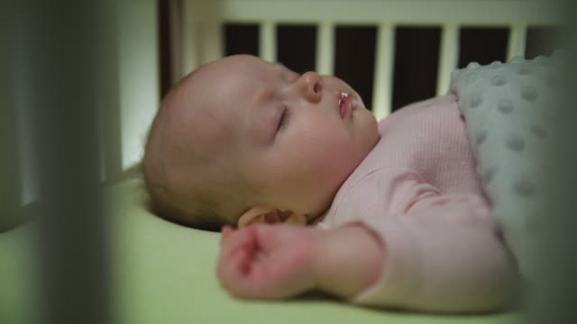 Side-View-of-Sleeping-Newborn-Baby-Dolly-Shot-Close-Up