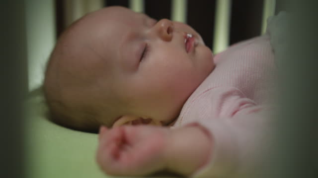 Side-View-of-Sleeping-Newborn-Baby-Dolly-Shot-Close-Up