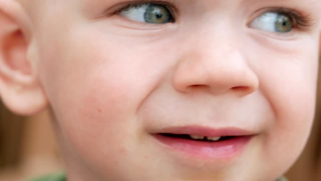 The-blond,-handsome-boy-looks-away.-The-baby-is-less-than-two-years-old.-Close-up