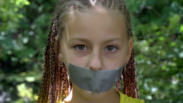 A-girl-with-a-taped-mouth