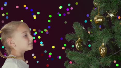 Excited-young-white-girl-decorating-christmas-tree-and-with-happy-looking-to-fir-tree.-Preparing-for-Merry-Christmas-and-Happy-New-Year-celebrate-Holiday.-Abstract-colorful-flicker-background.