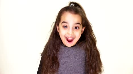 Little-cute-caucasian-girl,-smiling,-showing-an-emotion-of-surprise,-wide-open-mouth,-portrait-white-background-50-fps