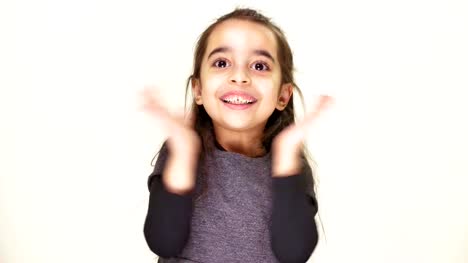 Little-cute-cheerful-girl-smiles-and-claps-her-hands,-rejoices,-white-background-50-fps