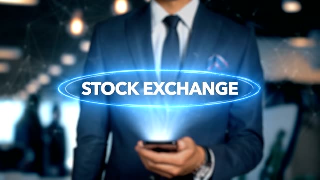 Businessman-With-Mobile-Phone-Opens-Hologram-HUD-Interface-and-Touches-Word---STOCK-EXCHANGE