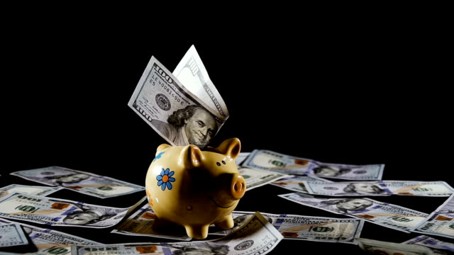 piggy-bank.-Piggy-bank-and-one-hundred-dollar-bills