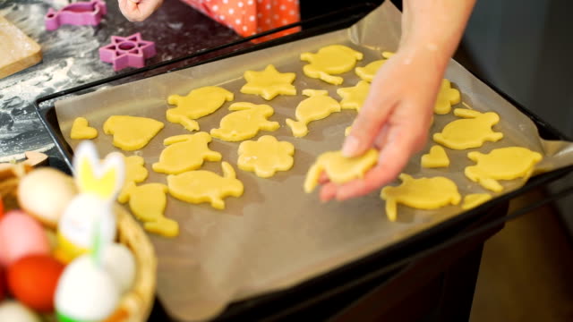 Woman-Putting-Easter-Cookies-on-a-Baking-Tray