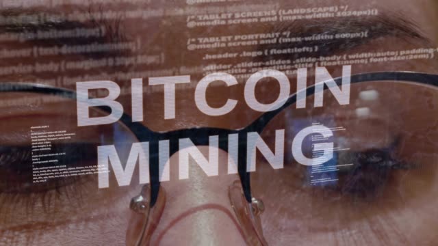 Bitcoin-Mining-text-on-background-of-female-developer
