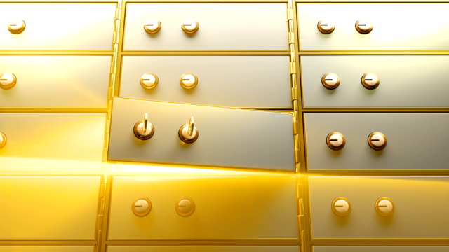 Caja-de-seguridad-abierta-por-dos-llaves-doradas-y-luego-aparece-una-luz-brillante