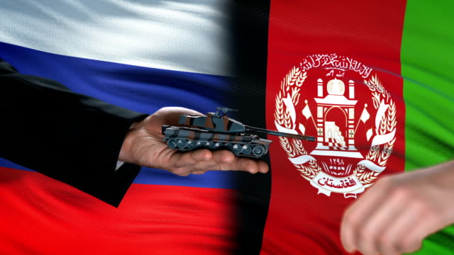 Russia-and-Afghanistan-officials-exchanging-tank-for-money,-flag-background