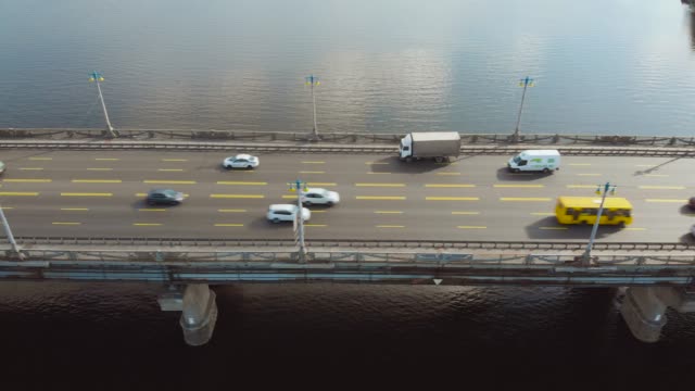 Aerial-view-car-traffic-on-river-bridge