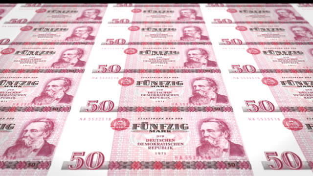 Banknotes-of-fifty-german-marks-or-deutschmarks-of-the-bank-of-the-old-German-republic-rolling-on-screen,-coins-of-the-world,-cash-money,-loop