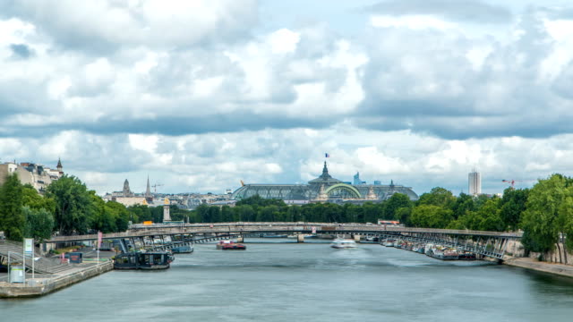 View-of-the-Grand-Palais-exhibition-hall-and-boats-on-the-Seine-River-as-seen-from-Royal-bridge-timelapse