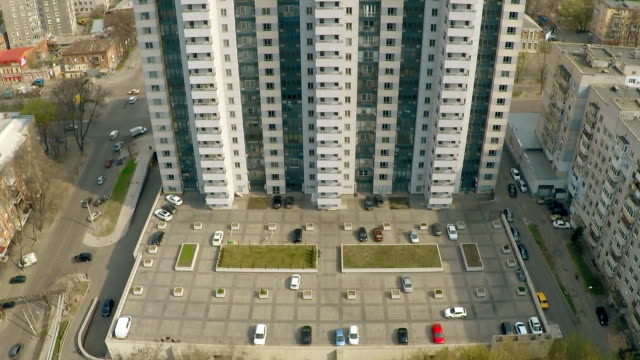 Residential-building-with-car-parkings-and-child-playground.-Real-estate-establishing-shot