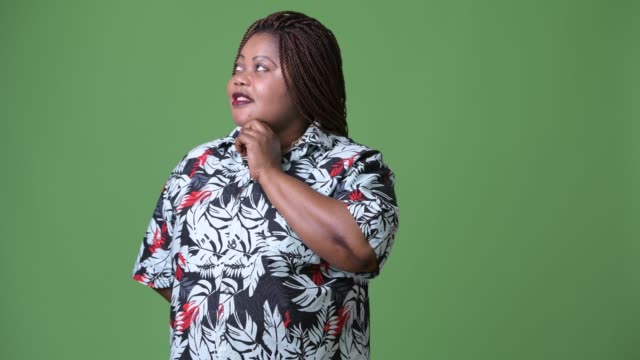 Overweight-beautiful-African-woman-against-green-background